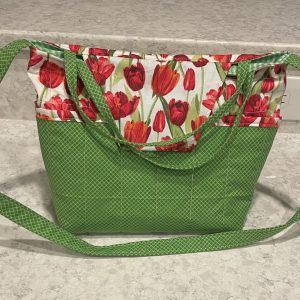 Purse-red tulips in the grass