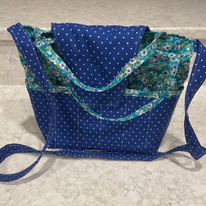 Purse-blue with white dots with blue and green floral