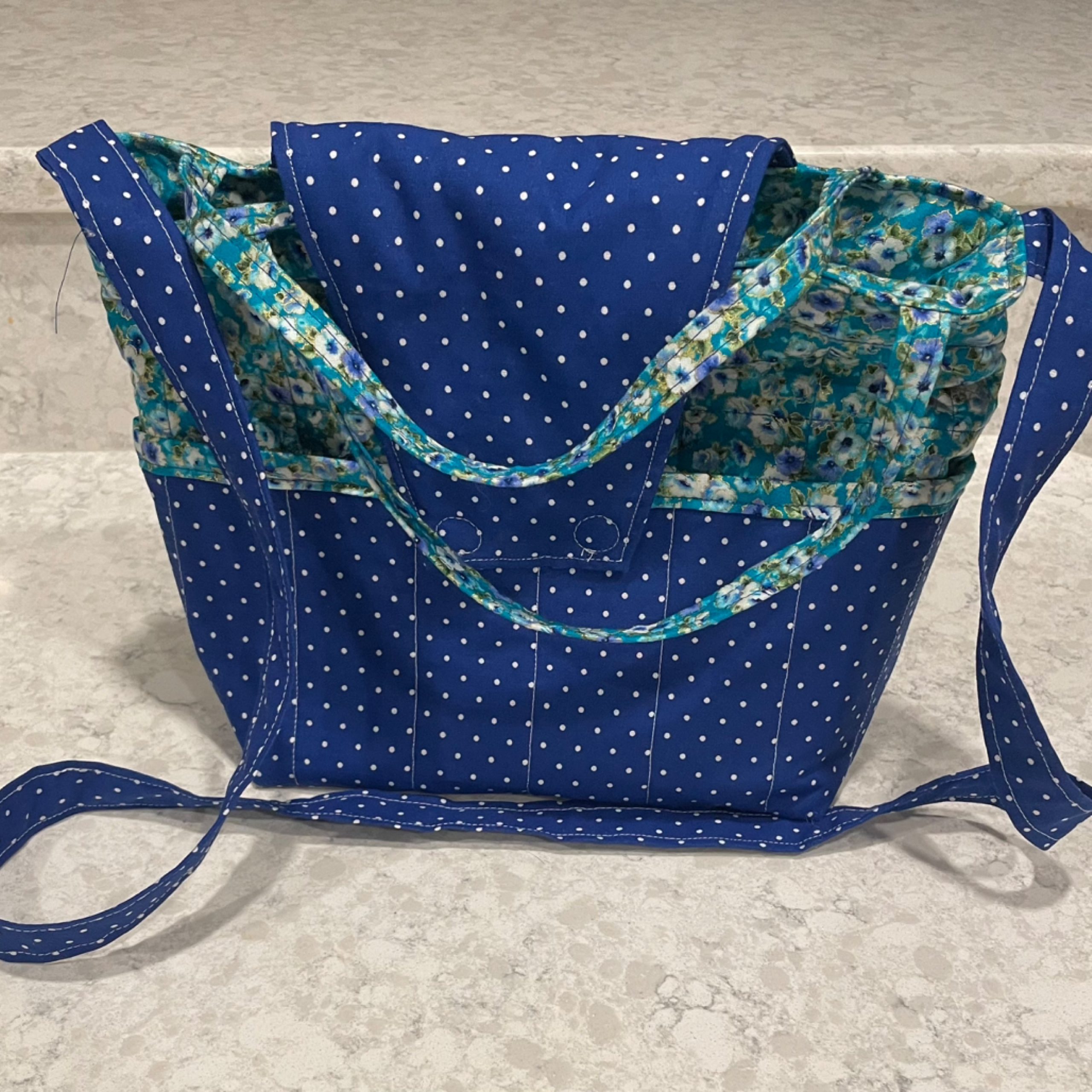 Purse-blue with white dots with blue and green floral